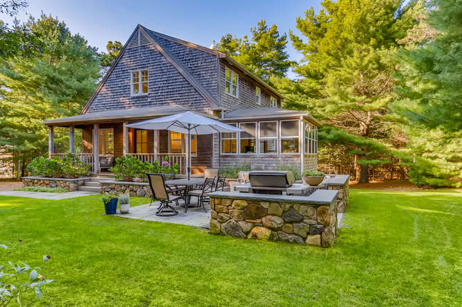 4 Penny Lane Edgartown, MA 02539 - Photo 50 of 60 a view of a house with a yard porch and sitting area