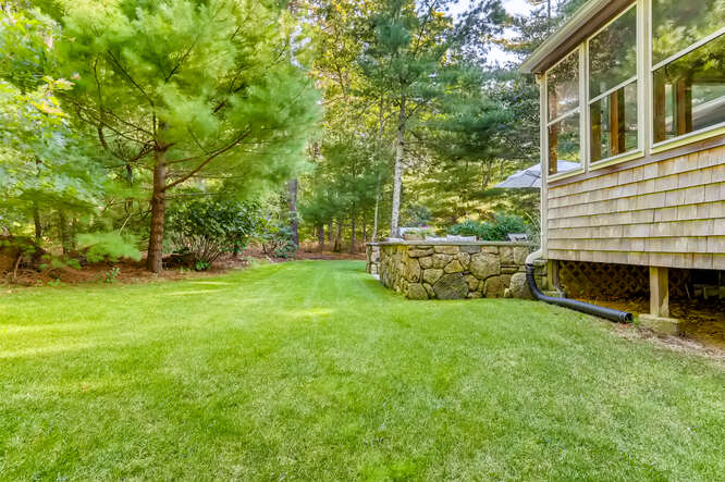 4 Penny Lane Edgartown, MA 02539 - Photo 54 of 60 a view of backyard with barbeque oven and trees