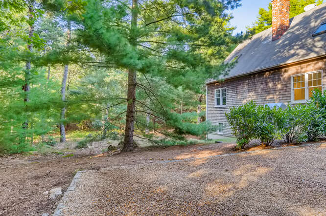 4 Penny Lane Edgartown, MA 02539 - Photo 57 of 60 a view of a backyard with large trees