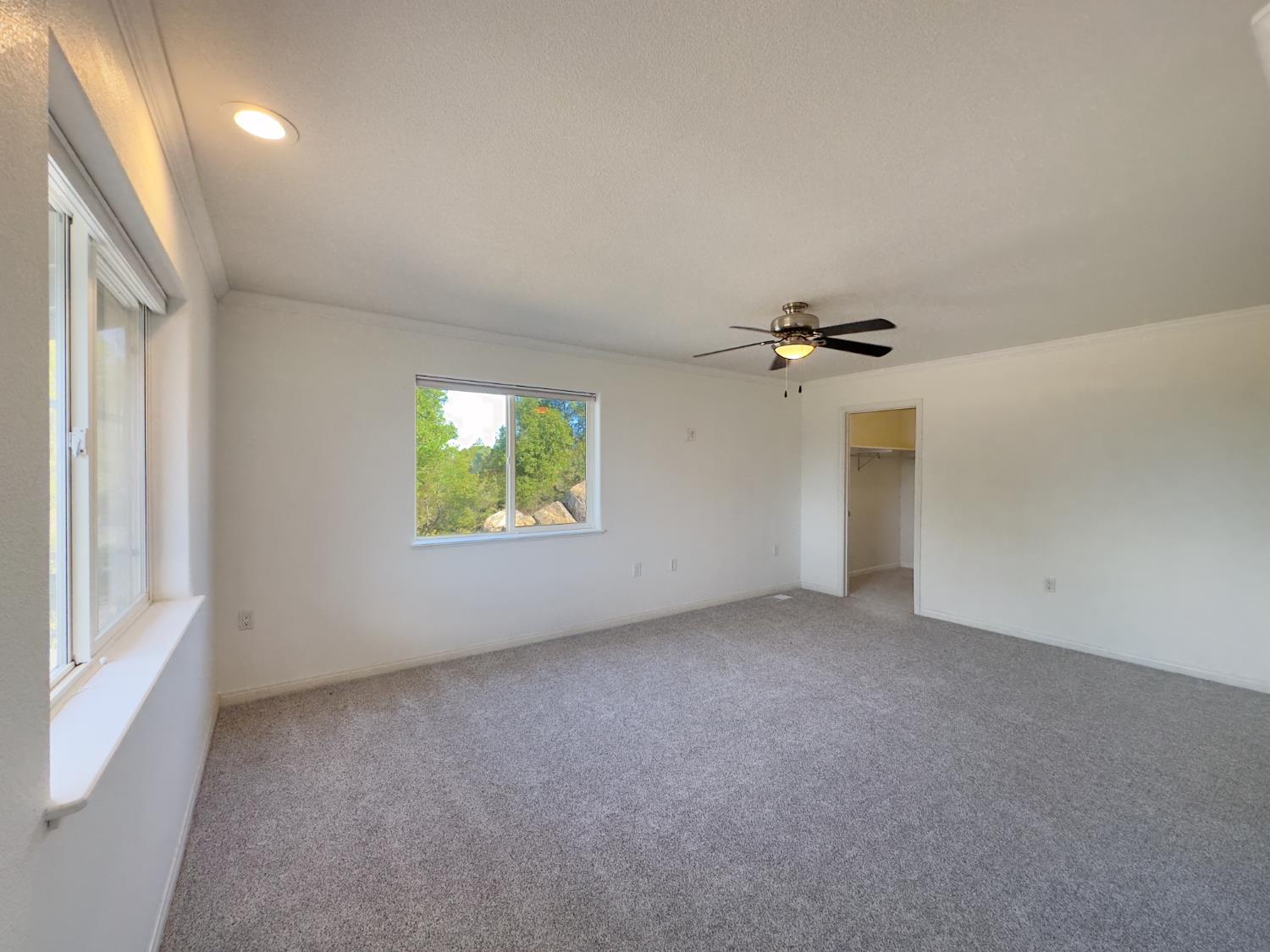 123 No Address Drive Rough and Ready, CA 95975 - Photo 19 of 95 an empty room with windows and fan