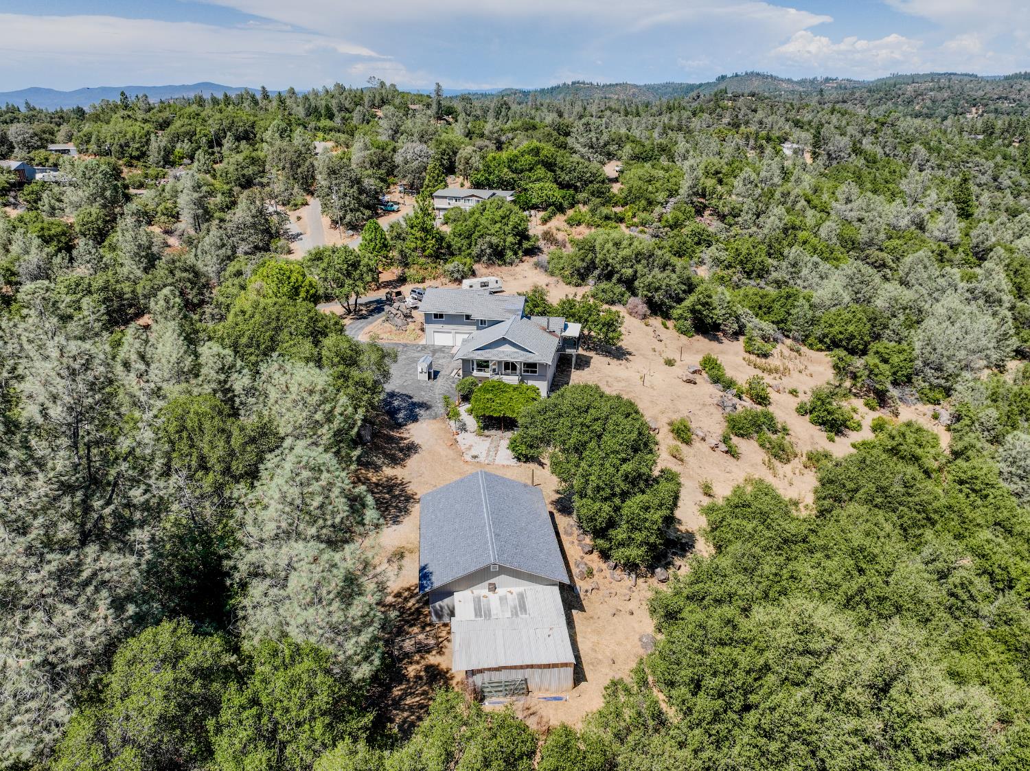 123 No Address Drive Rough and Ready, CA 95975 - Photo 30 of 95 an aerial view of a house with a yard and lake view