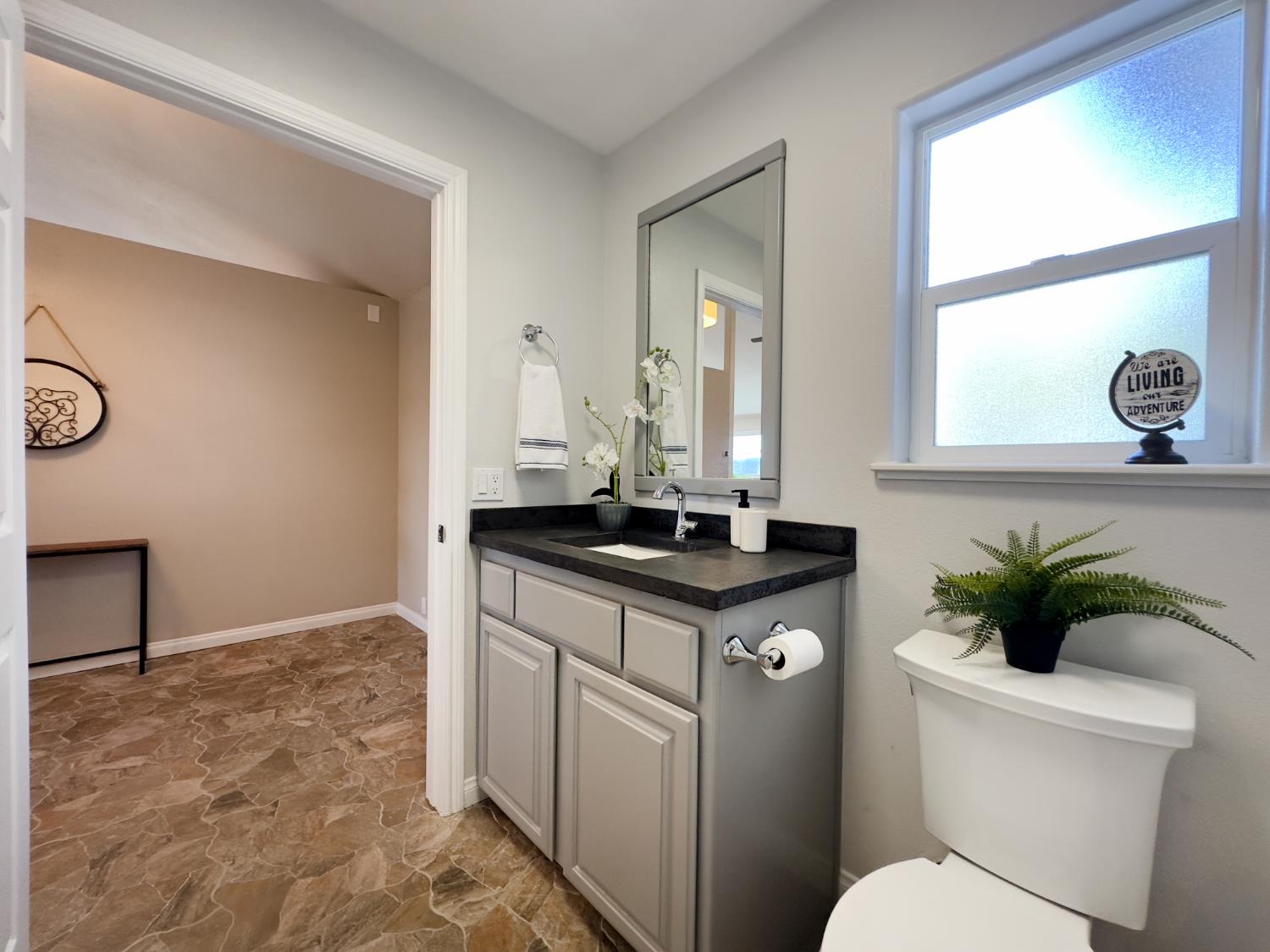 123 No Address Drive Rough and Ready, CA 95975 - Photo 43 of 95 a bathroom with a toilet sink and mirror