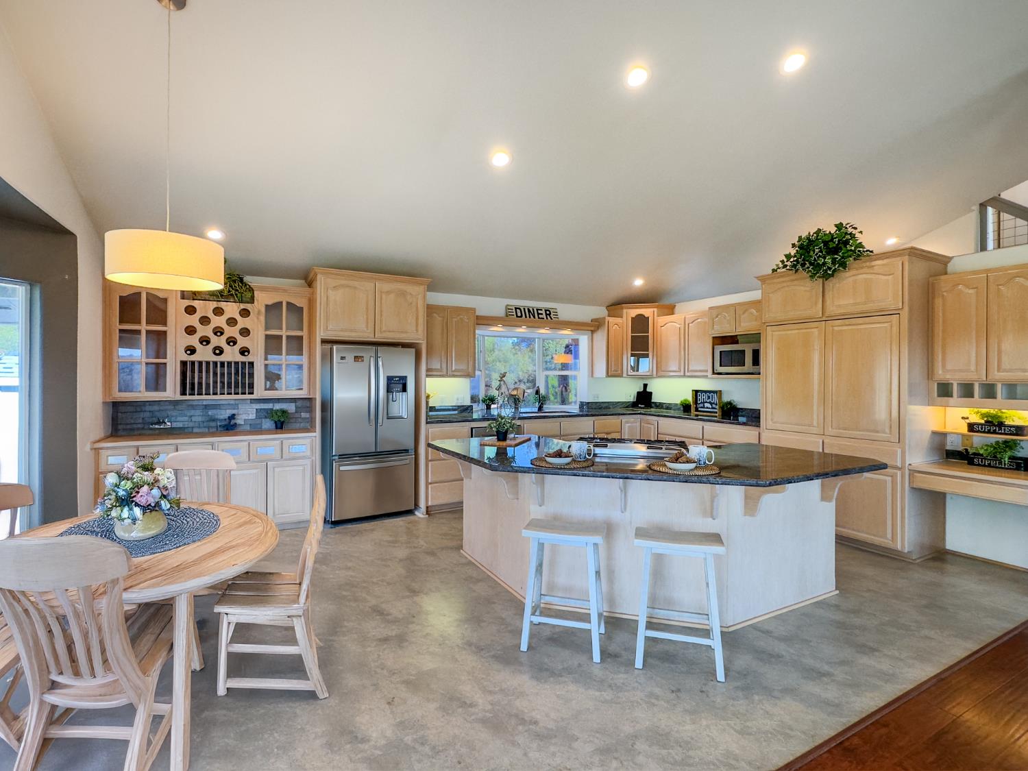 123 No Address Drive Rough and Ready, CA 95975 - Photo 63 of 95 a kitchen with a sink and chairs