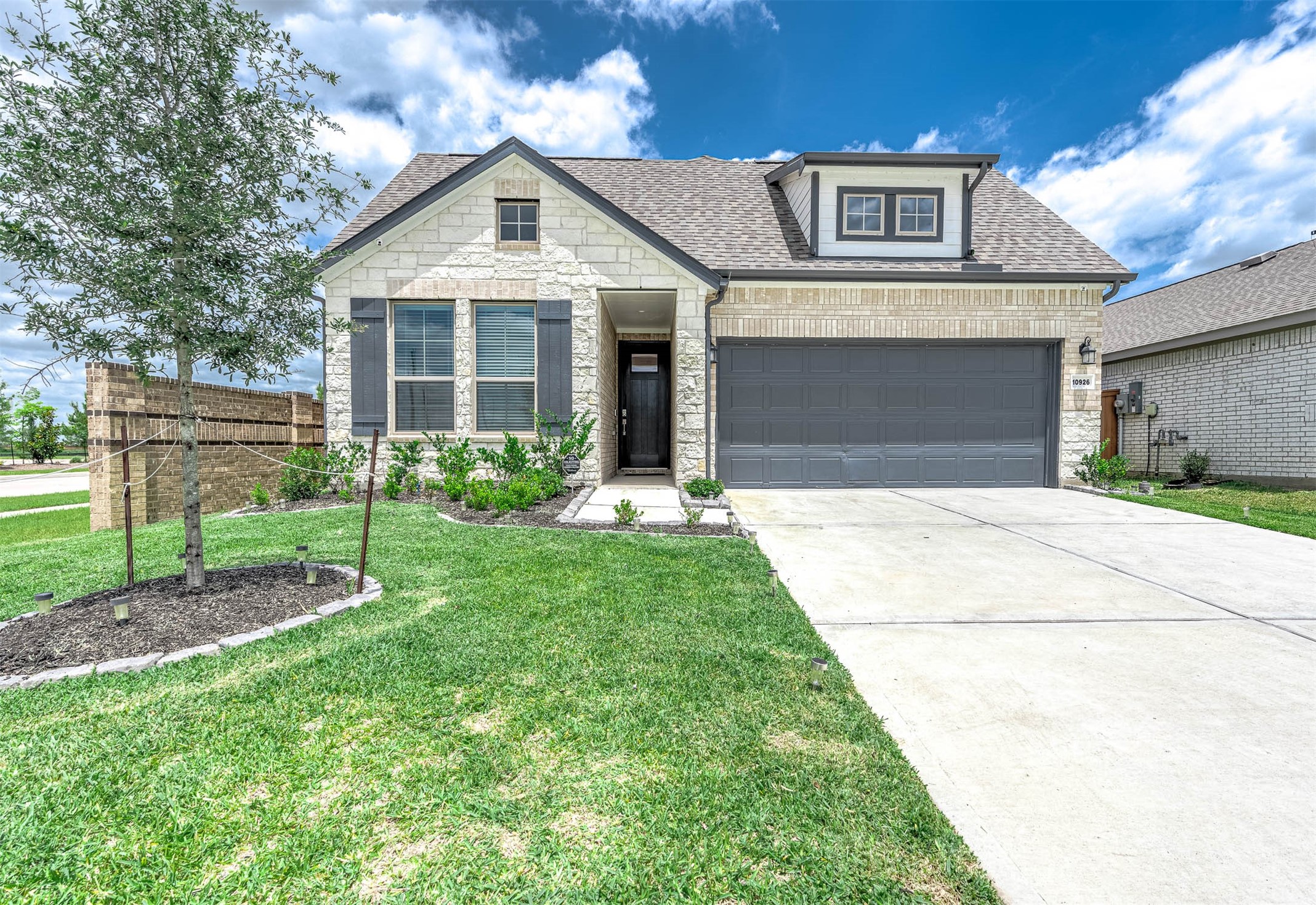 10926 Wander Way Beasley, TX 77417 - Photo 30 of 38 a front view of a house with a yard and garage