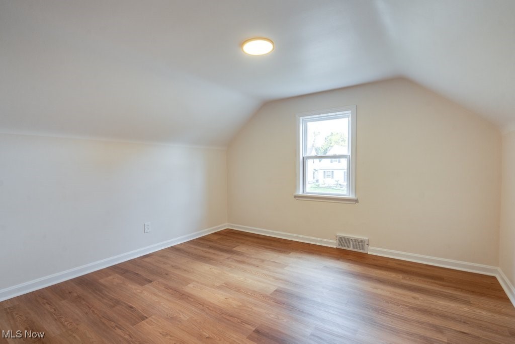 4237 Verona Road Cleveland, OH 44121 - Photo 30 of 41 Bonus room with vaulted ceiling and light wood-type flooring