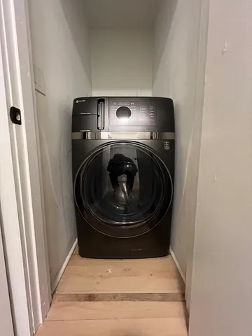a utility room with washing machine