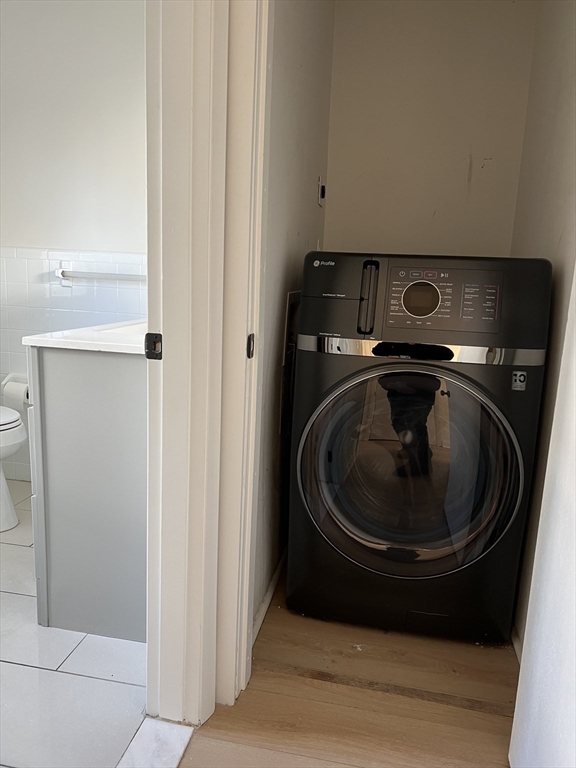 262 Nevada Street, Unit A Newton, MA 02460 - Photo 15 of 34 a utility room with washing machine