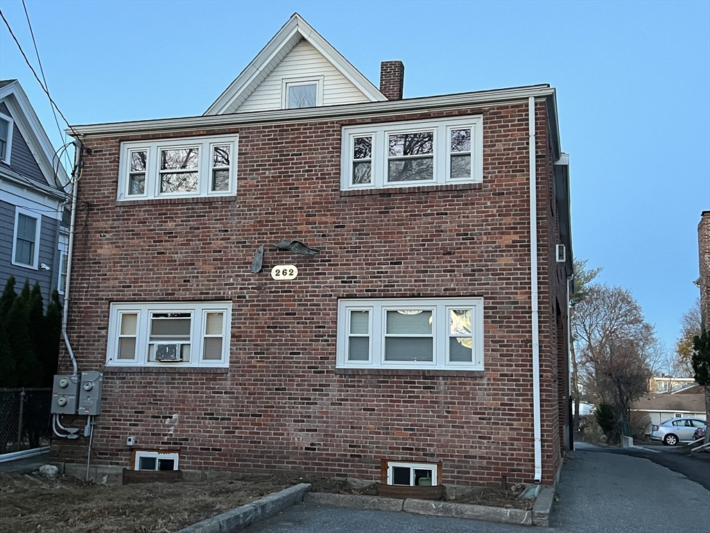 262 Nevada Street, Unit A Newton, MA 02460 - Photo 34 of 34 a front view of a house with yard