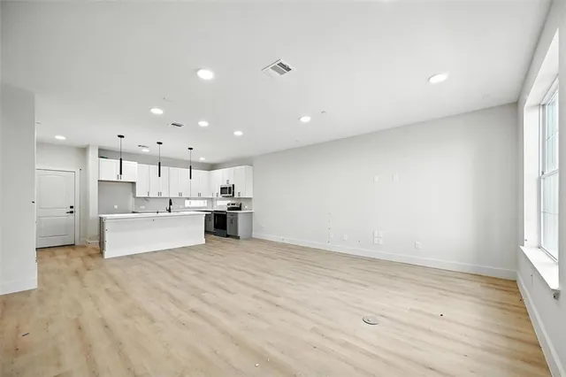 a view of kitchen with wooden floor