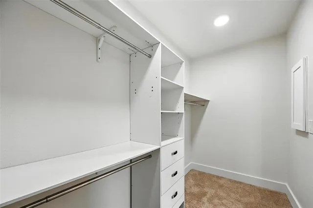 a room with cabinets and wooden floor