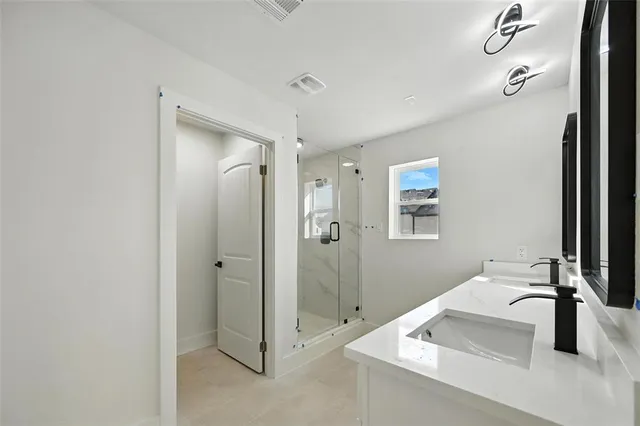 a bathroom with a sink and mirror