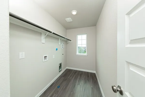 a view of a hallway with wooden floor and closet