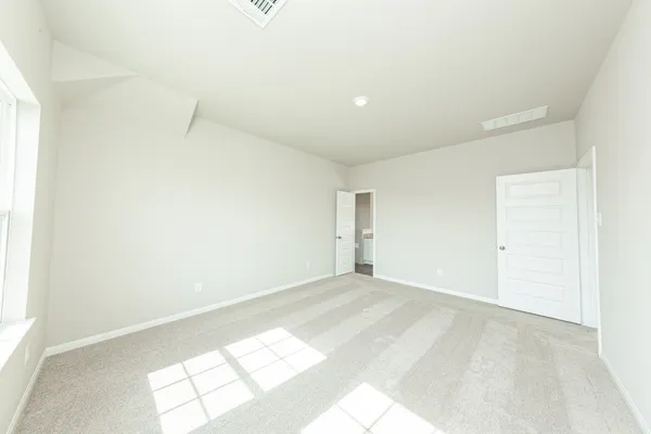 a view of an empty room and a window