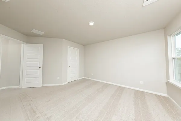 an empty room with windows