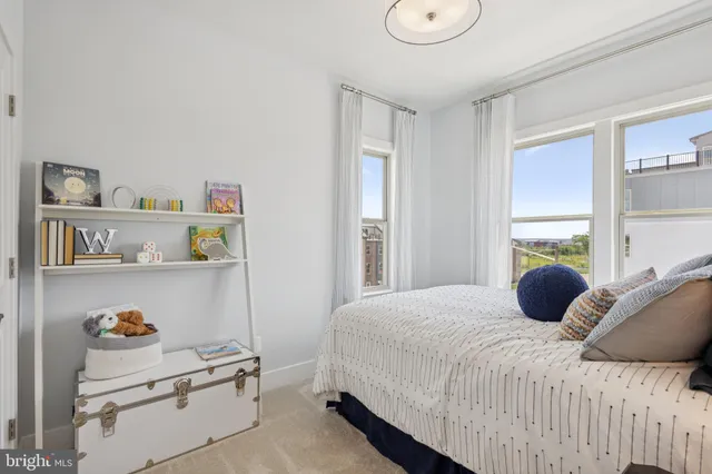 a bedroom with a bed a window and storage