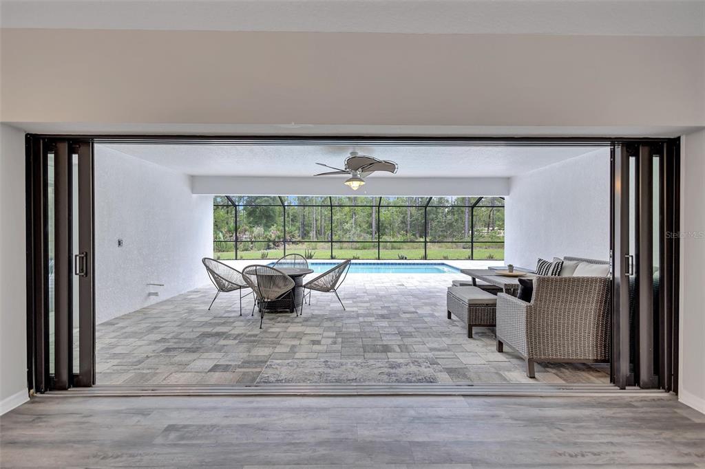 13362 Downy Woodpecker Road Weeki Wachee, FL 34614 - Photo 18 of 26 a view of a livingroom with furniture window and outside view