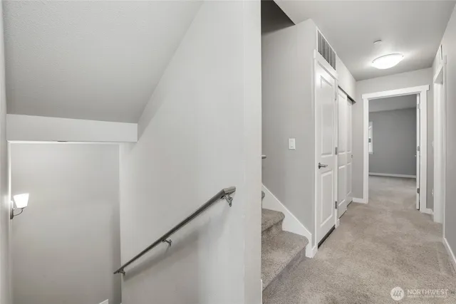 a view of a hallway with closet