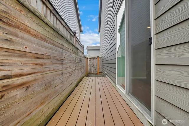 a view of balcony with wooden floor