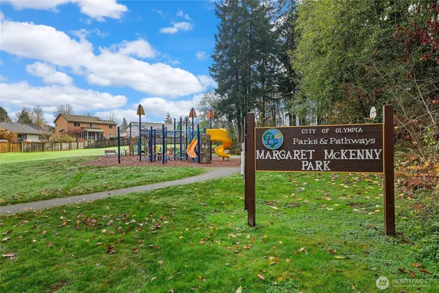 a view of a park with welcome board