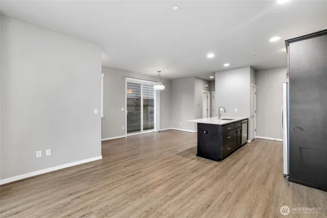 a view of kitchen and wooden floor