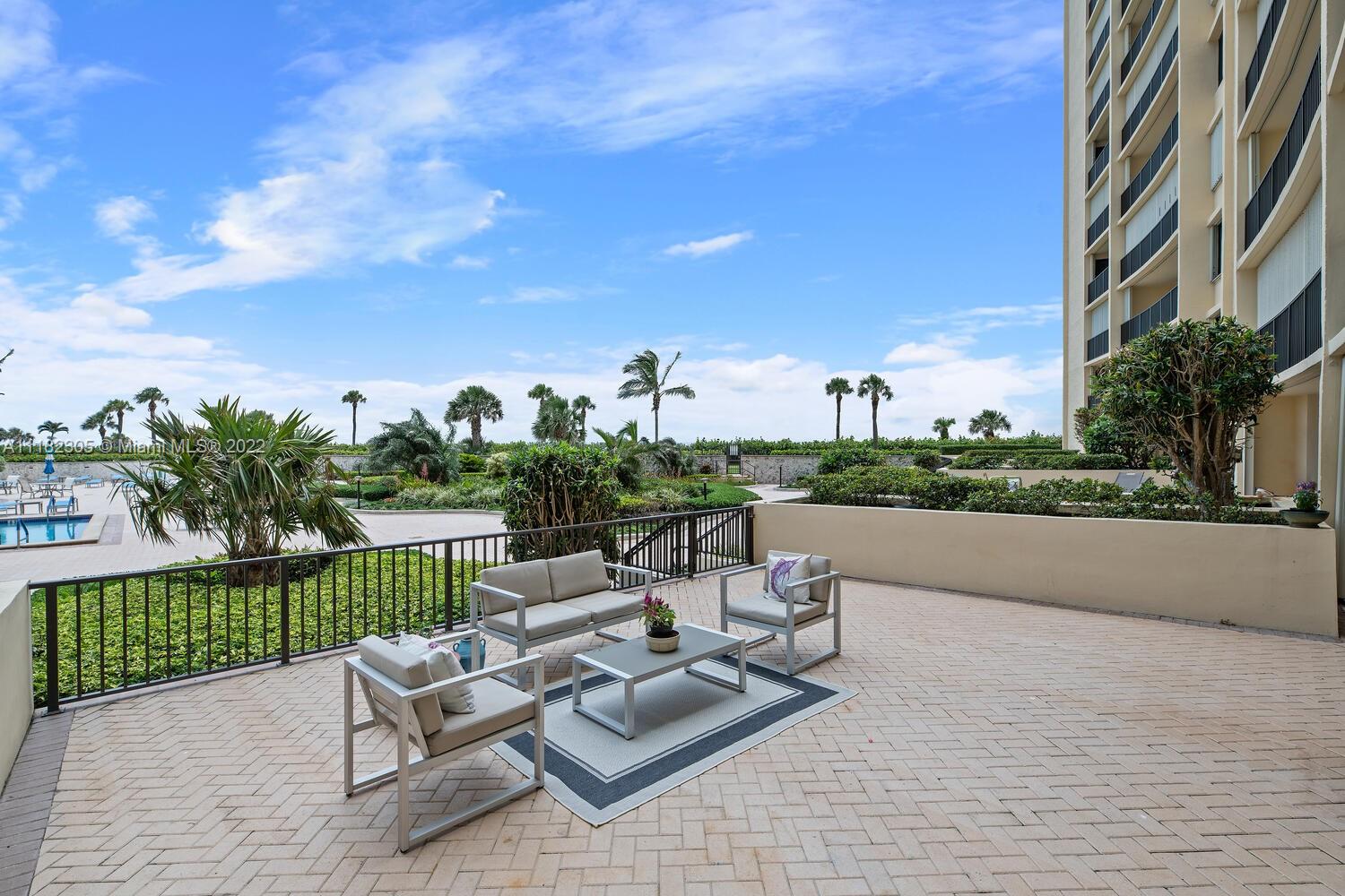 300 Ocean Trail Way, Unit 104 Jupiter, FL 33477 - Photo 14 of 26 a view of a terrace with couches and sky view