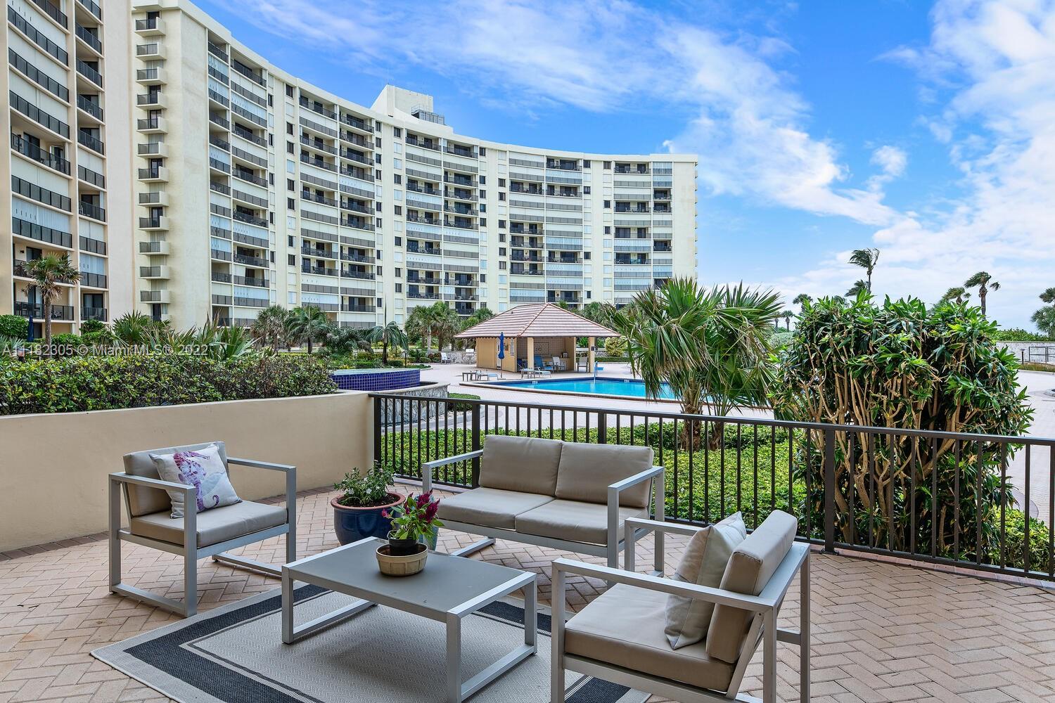 300 Ocean Trail Way, Unit 104 Jupiter, FL 33477 - Photo 15 of 26 a view of a balcony with chairs