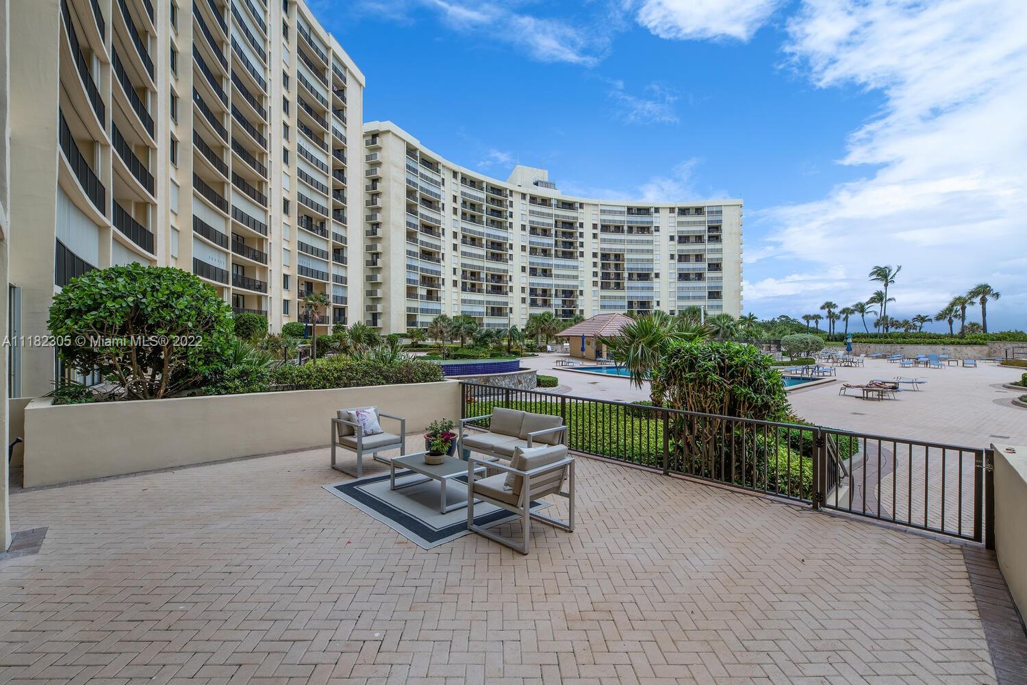 300 Ocean Trail Way, Unit 104 Jupiter, FL 33477 - Photo 16 of 26 a view of a terrace with sitting area