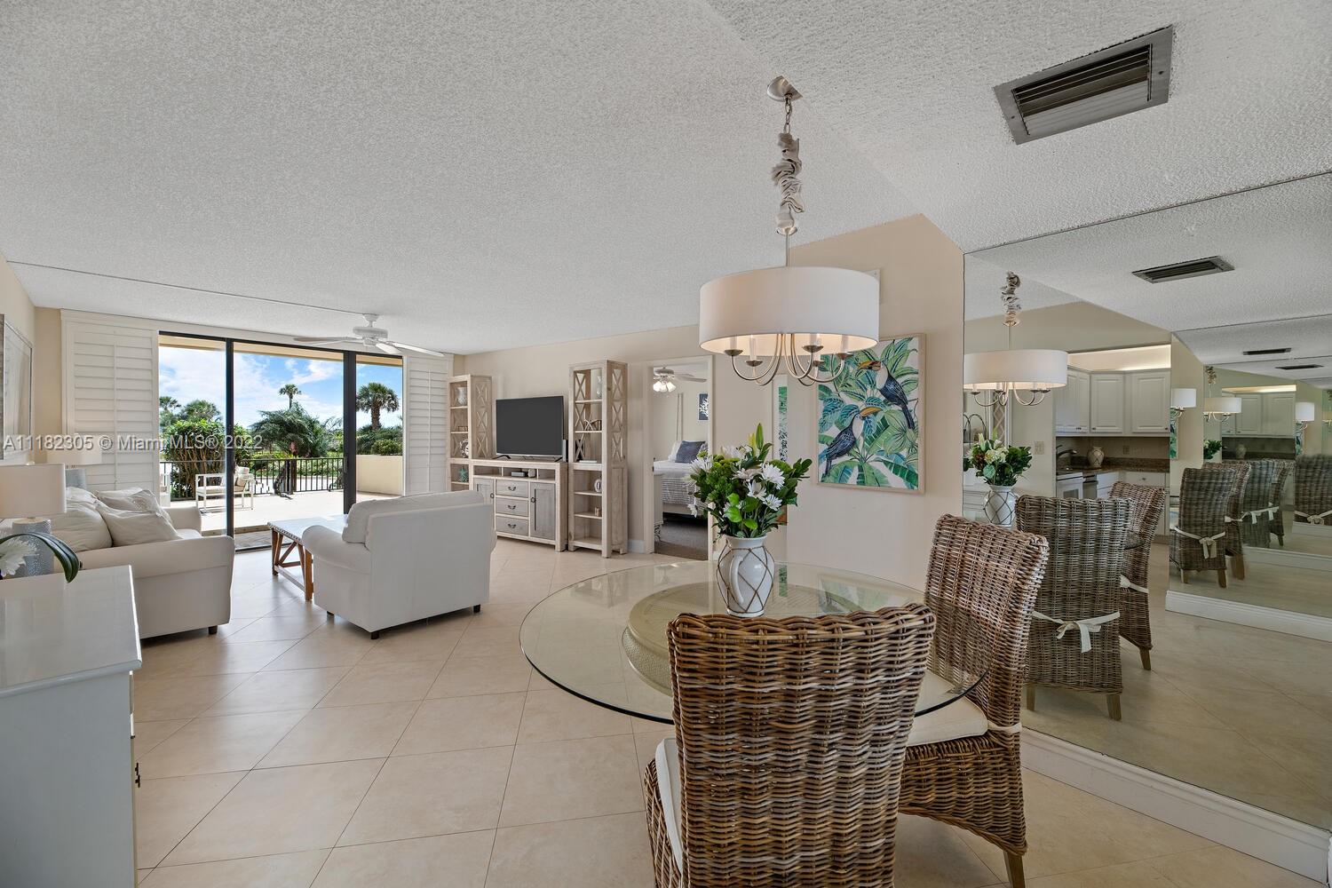 300 Ocean Trail Way, Unit 104 Jupiter, FL 33477 - Photo 4 of 26 a living room with furniture