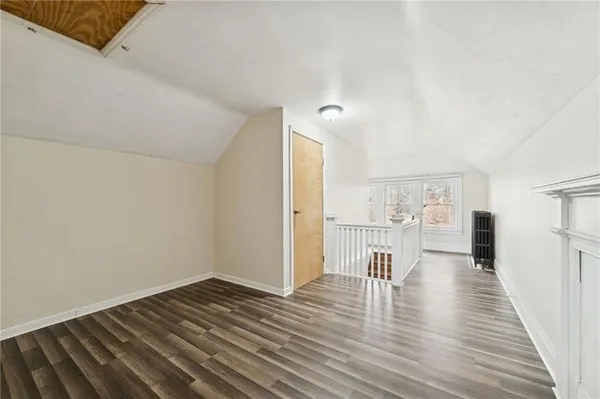 a view of a kitchen with wooden floor