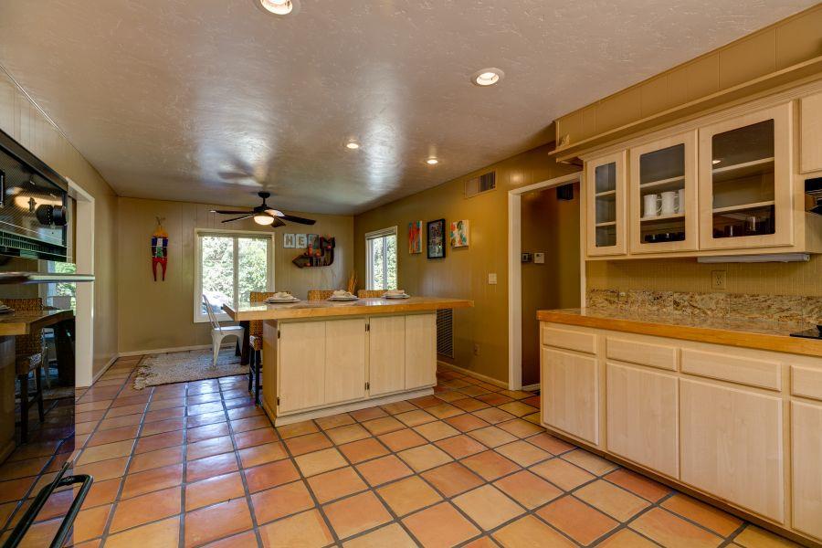 1195 Rancho Court Ojai, CA 93023 - Photo 15 of 49 a kitchen with a sink and cabinets
