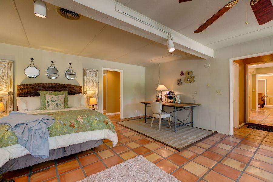 1195 Rancho Court Ojai, CA 93023 - Photo 21 of 49 a bedroom with a bed and a table in it