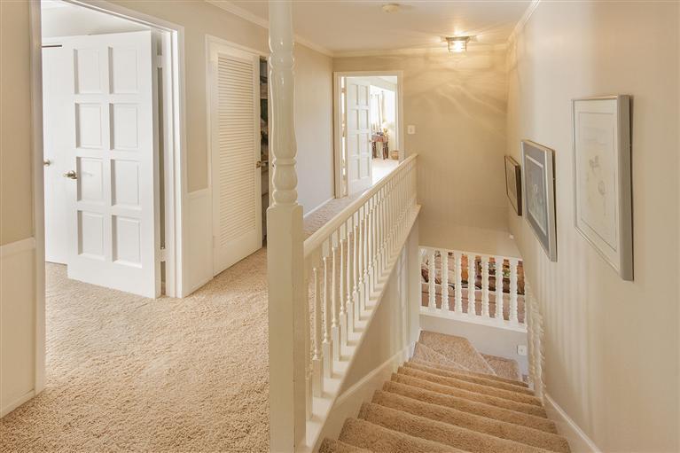 1195 Rancho Court Ojai, CA 93023 - Photo 25 of 49 a view of a hallway with wooden floor and staircase