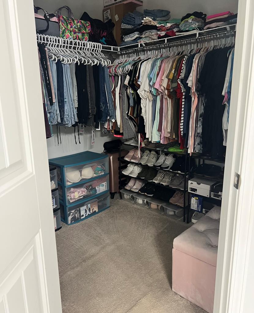 1048 Crosswinds Drive Midland, GA 31820 - Photo 12 of 25 a view of walk in closet with clothes and shoes