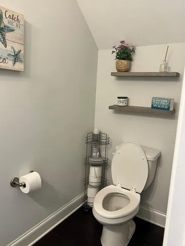 a bathroom with a toilet and a sink