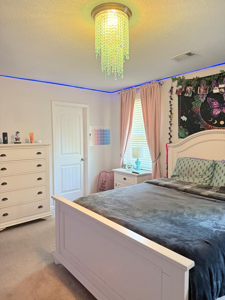 1048 Crosswinds Drive Midland, GA 31820 - Photo 18 of 25 a living room with a bed furniture and a window