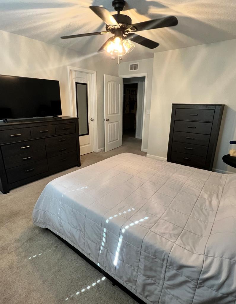 1048 Crosswinds Drive Midland, GA 31820 - Photo 23 of 24 a bedroom with a bed and a flat screen tv