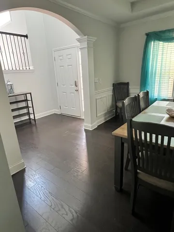 a view of a dining room with furniture and window