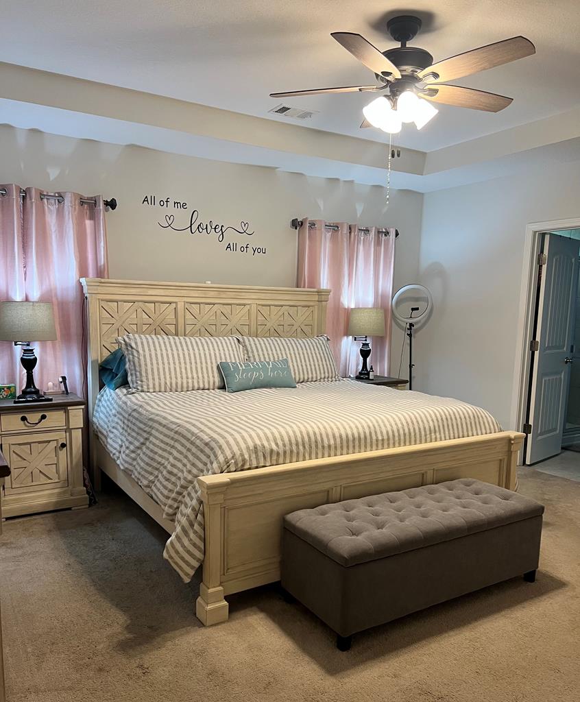 1048 Crosswinds Drive Midland, GA 31820 - Photo 9 of 25 a bedroom with a bed and a chandelier