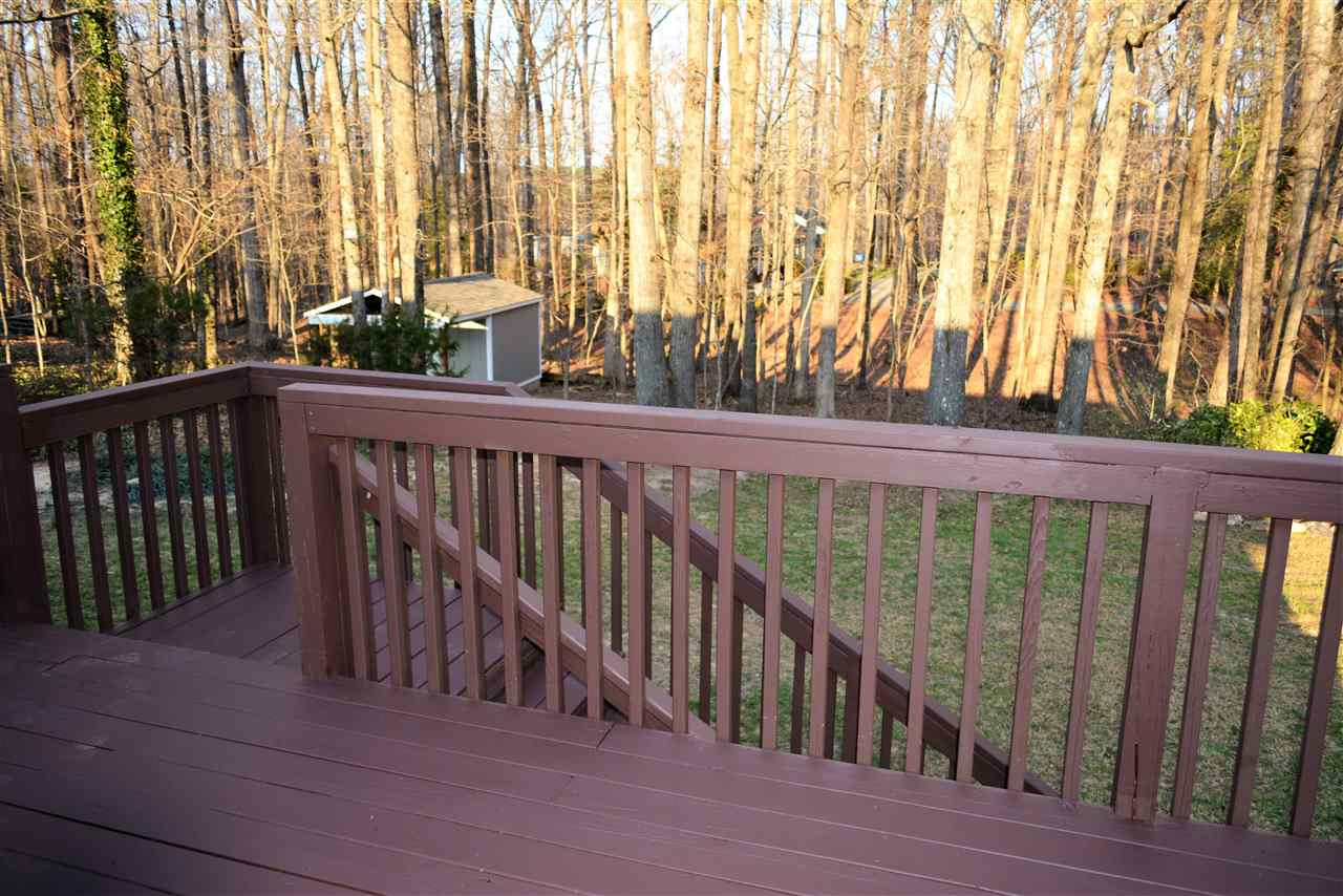 7249 Rock Service Station Road Raleigh, NC 27603 - Photo 23 of 25 View from your deck! Wow, enjoy privacy, also cookout with family & friends! Priceless view of hardwoods and rear lawn. What a view!