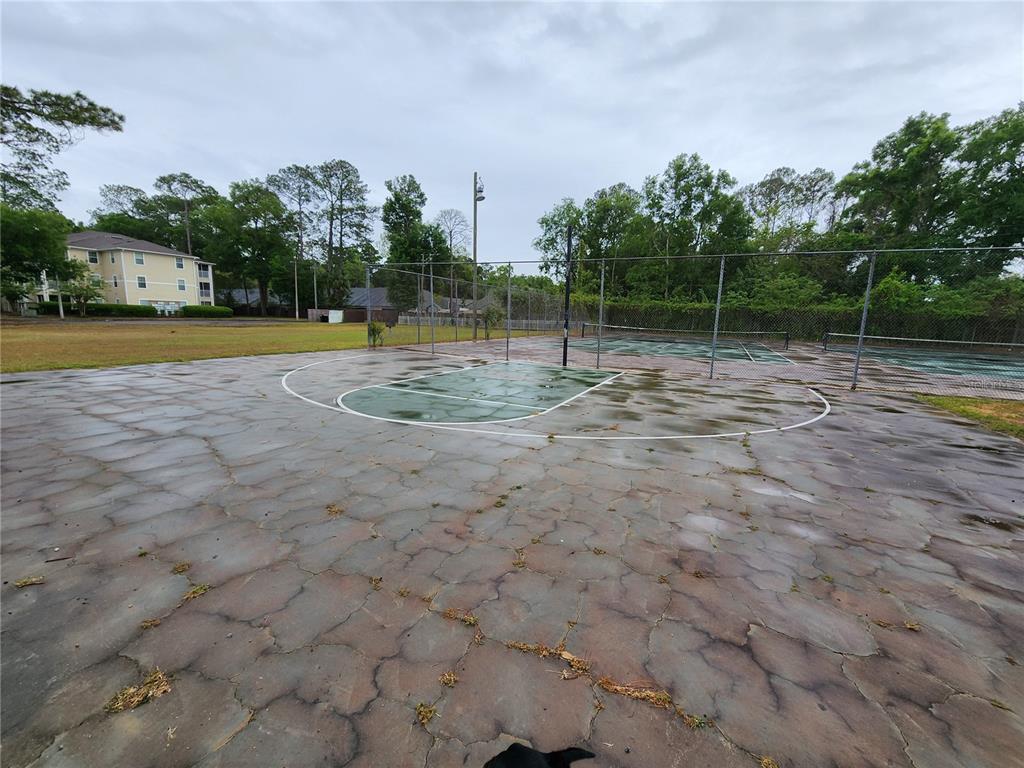 501 Southwest 75th Street, Unit A14 Gainesville, FL 32607 - Photo 51 of 56 a view of a playground with basketball court