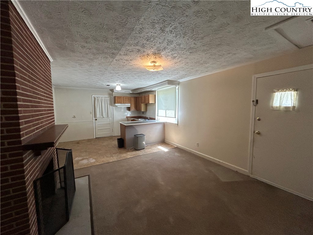 116 Cole Street Boone, NC 28607 - Photo 15 of 21 a view of a livingroom with furniture and a kitchen