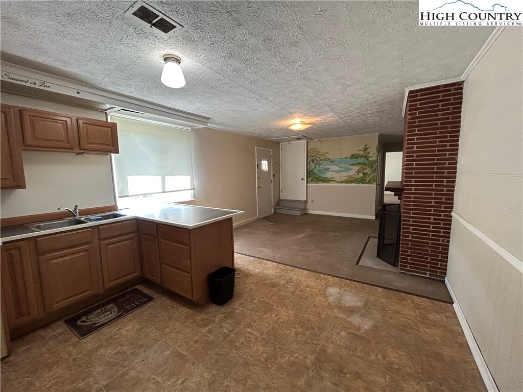 116 Cole Street Boone, NC 28607 - Photo 16 of 21 a kitchen with sink and cabinets