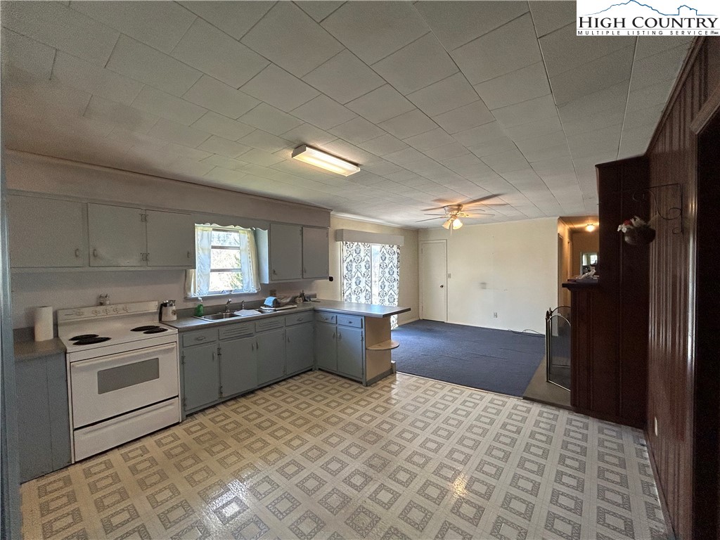 116 Cole Street Boone, NC 28607 - Photo 5 of 21 a kitchen with a sink appliances and cabinets