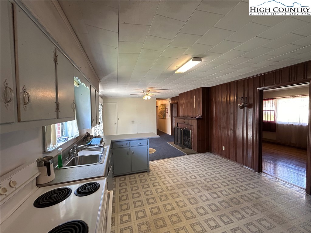 116 Cole Street Boone, NC 28607 - Photo 8 of 21 a bathroom with a sink a large mirror and shower