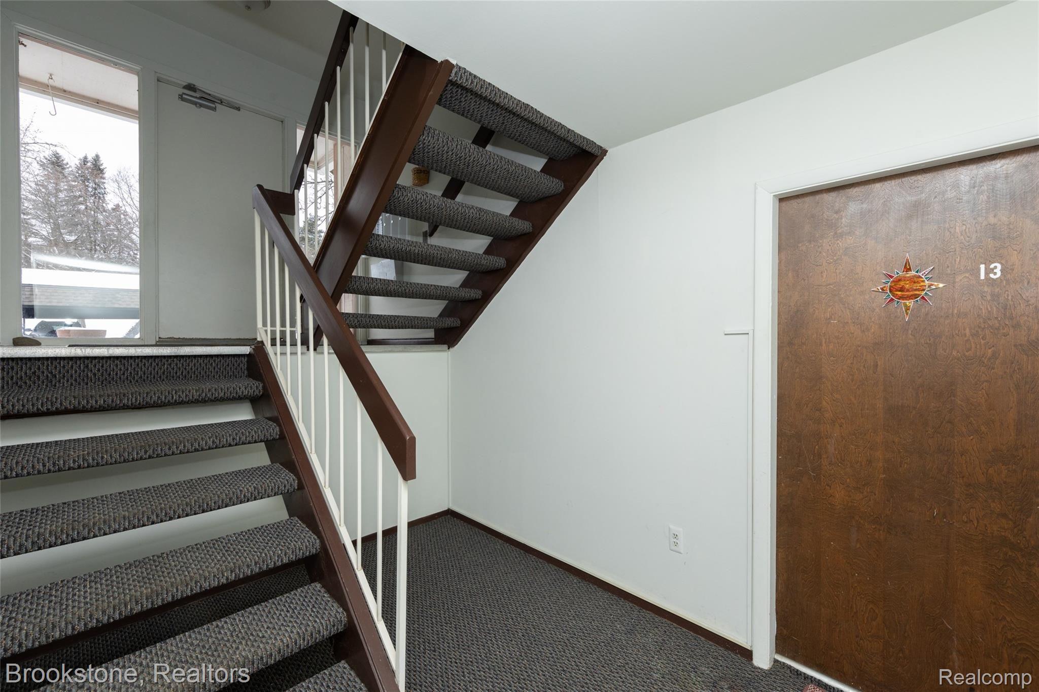 1677 Riverside Drive, Unit 13 Rochester, MI 48309 - Photo 5 of 21 Go Down One Flight of Stairs and Door is on the Left