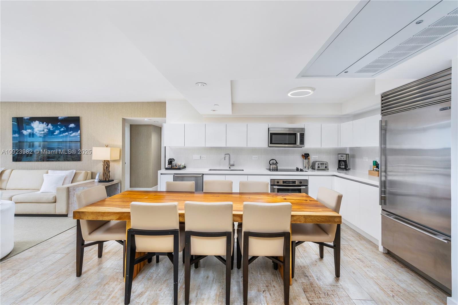 102 24th Street, Unit 1544 Miami Beach, FL 33139 - Photo 4 of 20 a view of a dining room with furniture and wooden floor