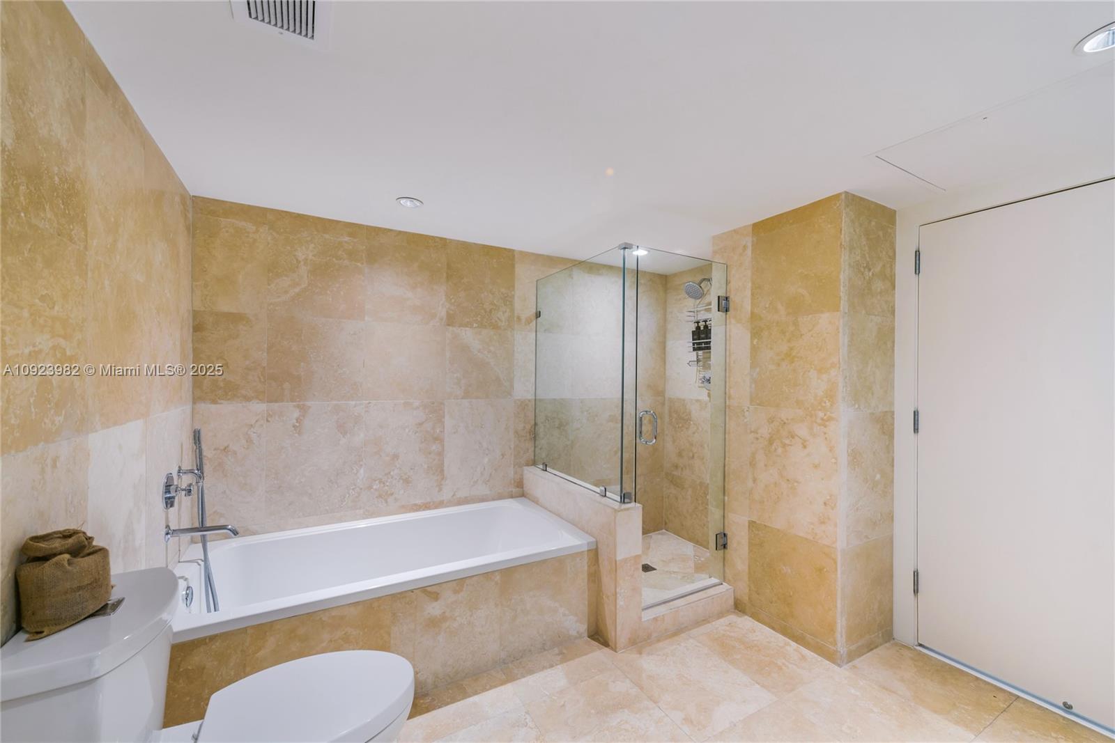 102 24th Street, Unit 1544 Miami Beach, FL 33139 - Photo 10 of 20 a bath room with a bath tub and a shower