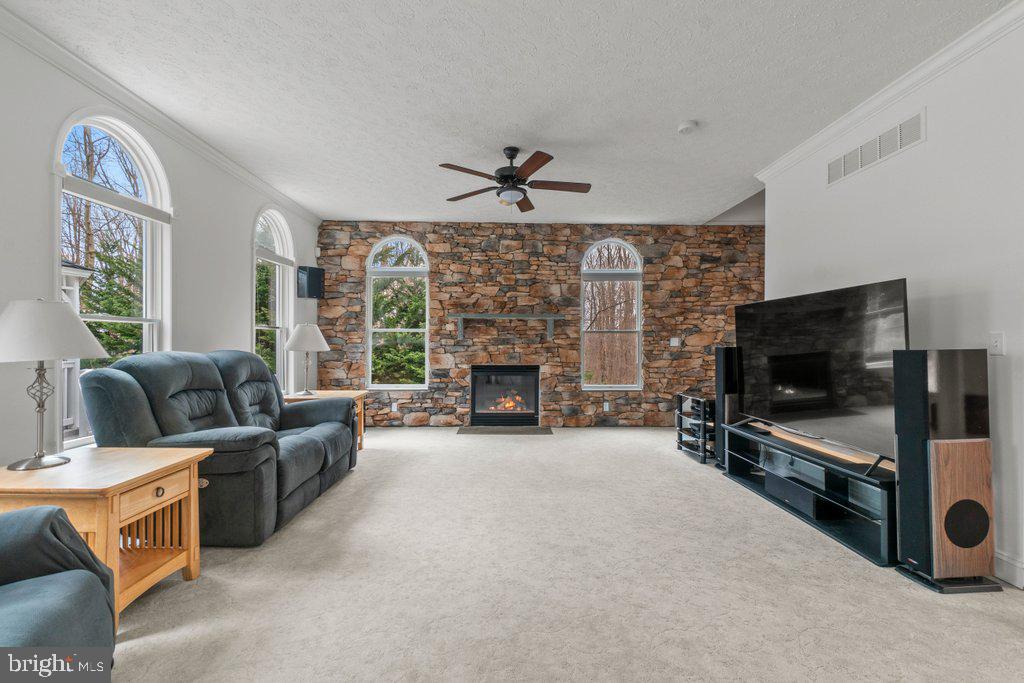 1633 Freeland Road Freeland, MD 21053 - Photo 14 of 73 a living room with furniture and a flat screen tv