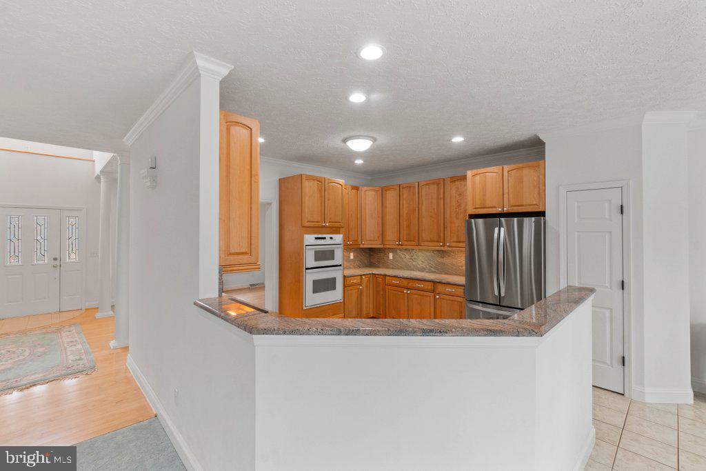 1633 Freeland Road Freeland, MD 21053 - Photo 17 of 73 a kitchen with stainless steel appliances granite countertop a refrigerator and a sink