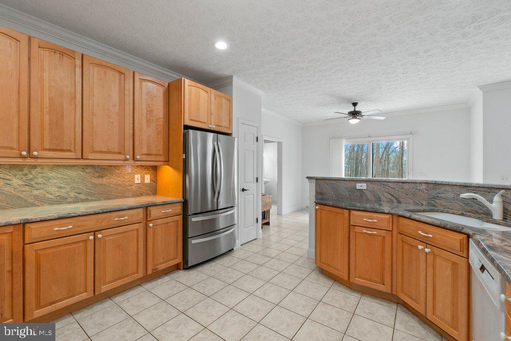 1633 Freeland Road Freeland, MD 21053 - Photo 20 of 73 a kitchen with stainless steel appliances granite countertop a refrigerator sink and cabinets